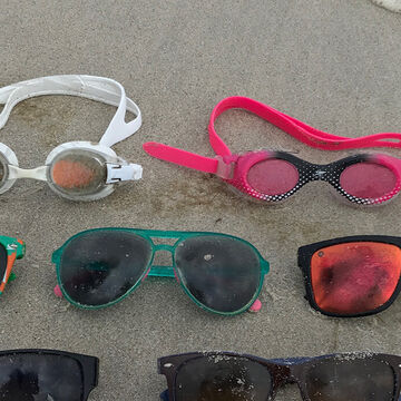 plastic sunglasses lost on the beach