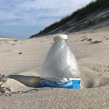 plastic water bottle left on beach