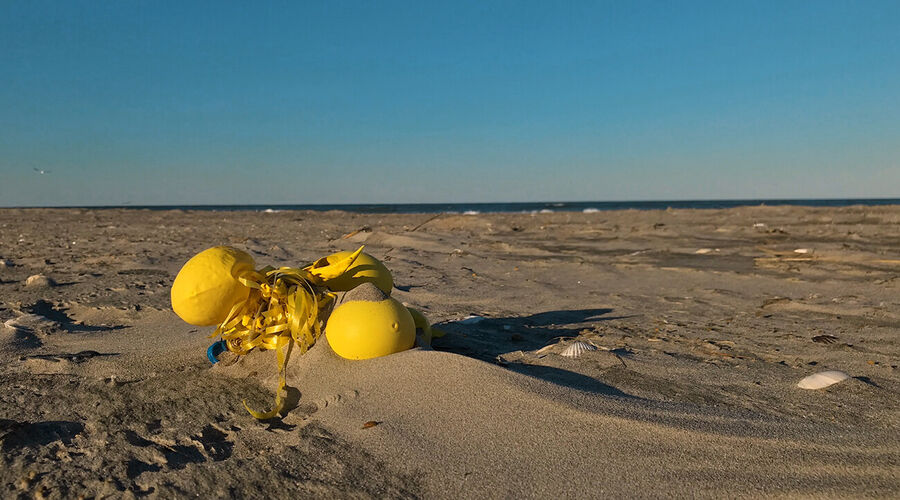 Balloons litter the beach on Cape Hatteras National Seashore.